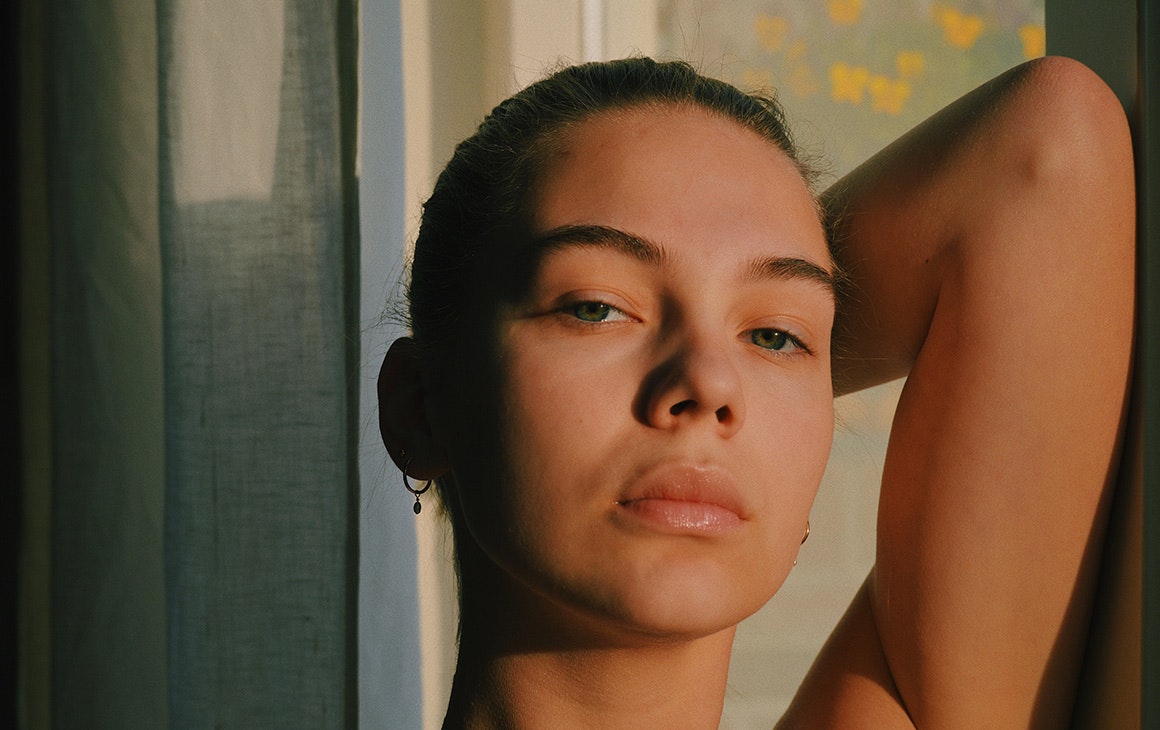 a close up image of a woman's bare face.
